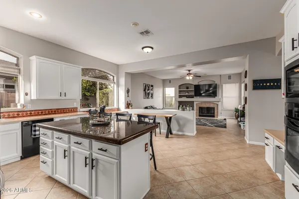 a kitchen with stainless steel appliances granite countertop a stove oven and a refrigerator
