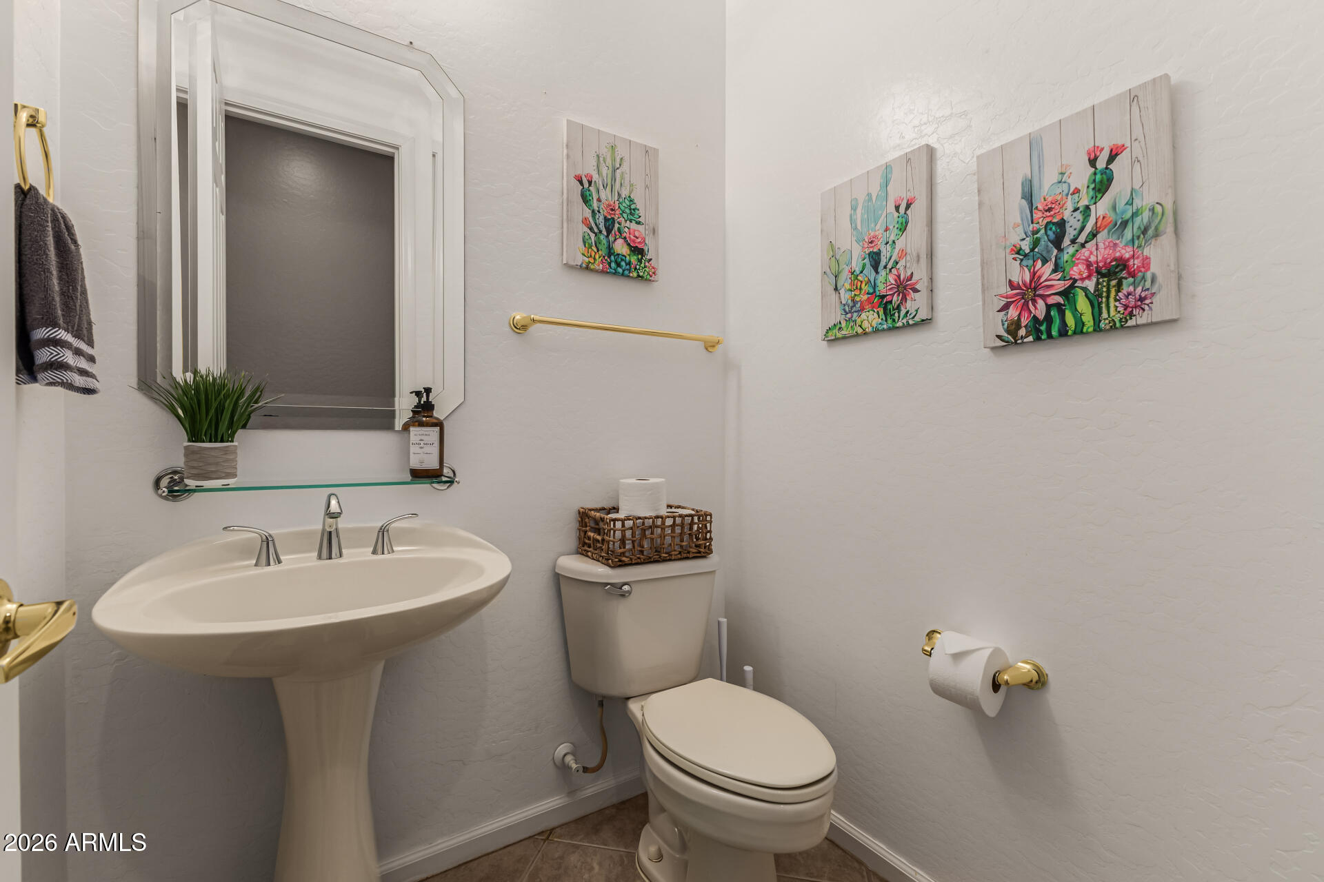 13318 West Coronado Road Goodyear, AZ 85395 - Photo 20 of 48 a bathroom with a sink mirror and toilet