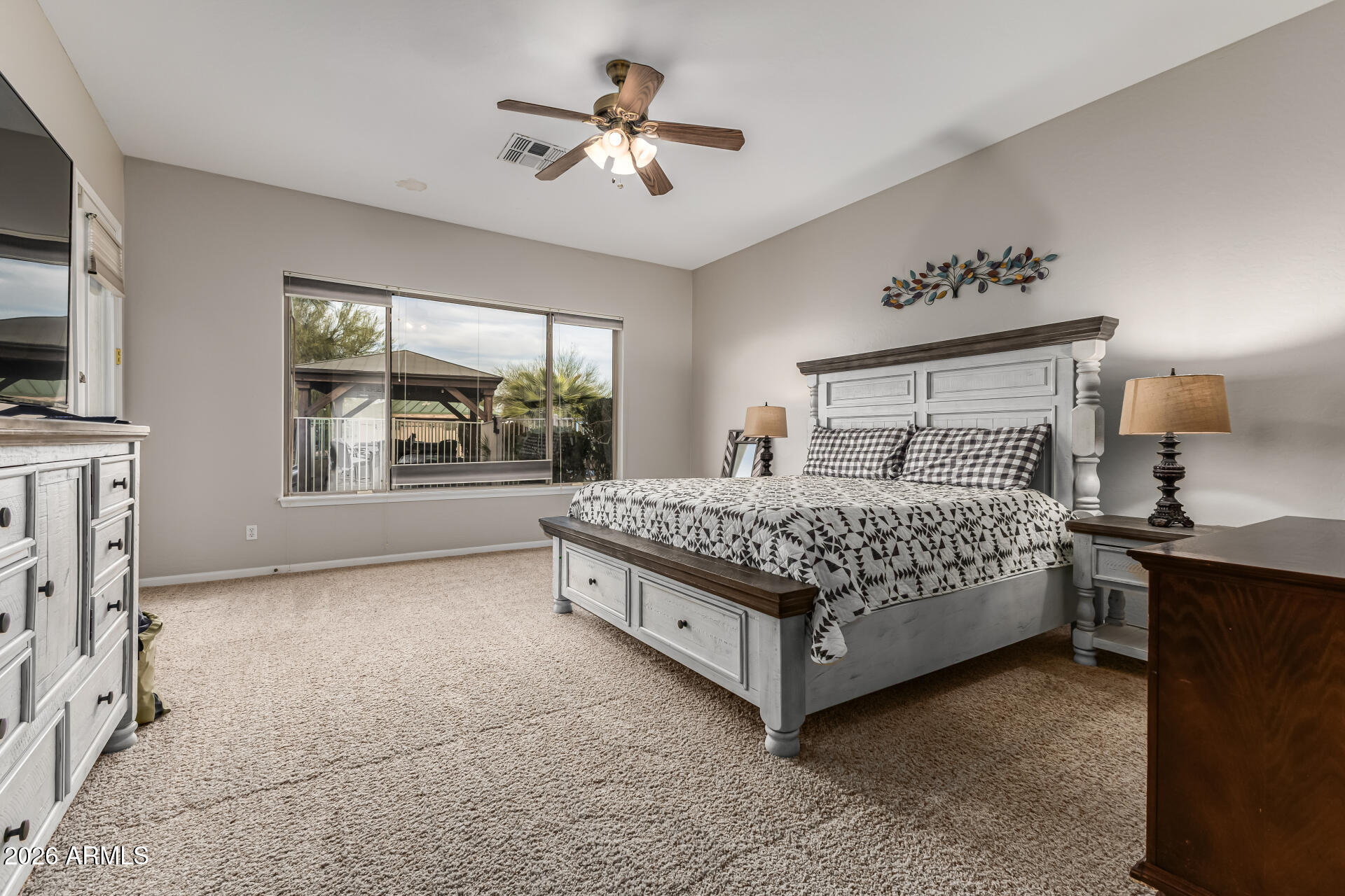 13318 West Coronado Road Goodyear, AZ 85395 - Photo 21 of 48 a bedroom with a bed and window