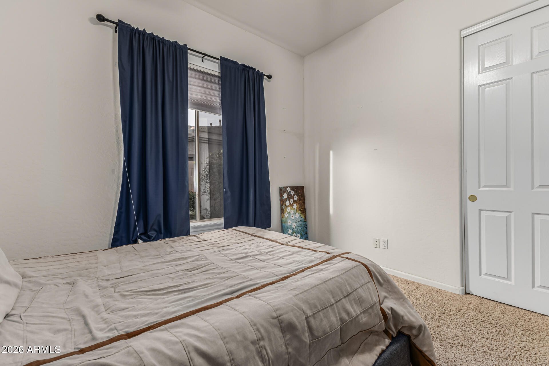13318 West Coronado Road Goodyear, AZ 85395 - Photo 28 of 48 a bedroom with a bed and a window
