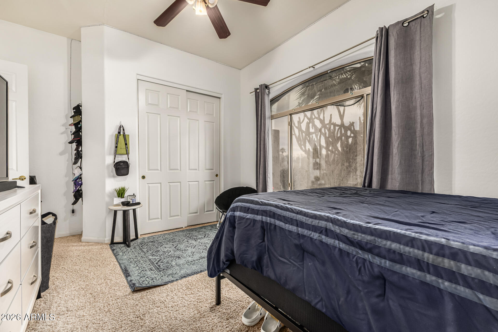 13318 West Coronado Road Goodyear, AZ 85395 - Photo 31 of 48 a bed sitting in a spacious bedroom next to a window
