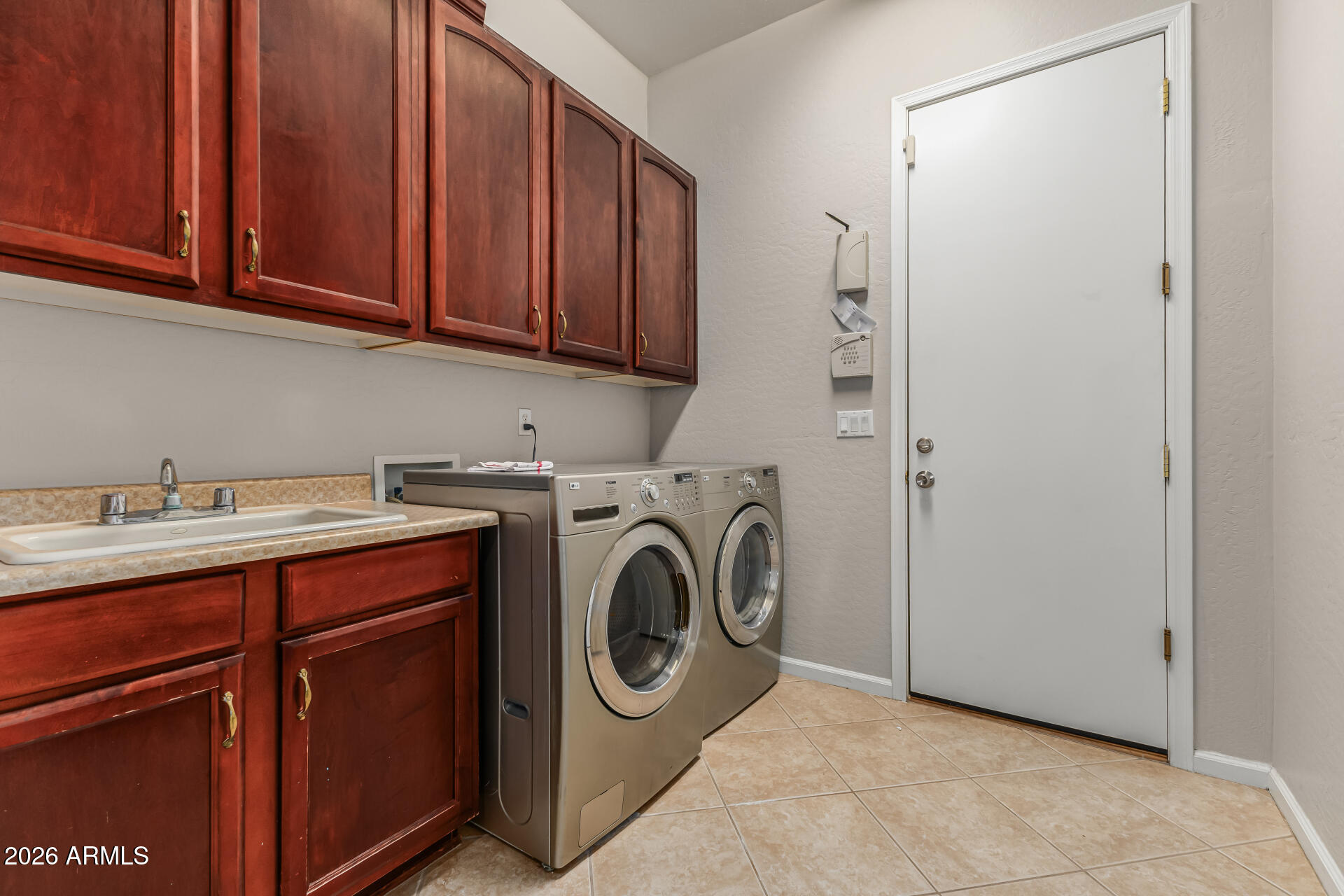 13318 West Coronado Road Goodyear, AZ 85395 - Photo 34 of 48 a utility room with dryer and washer