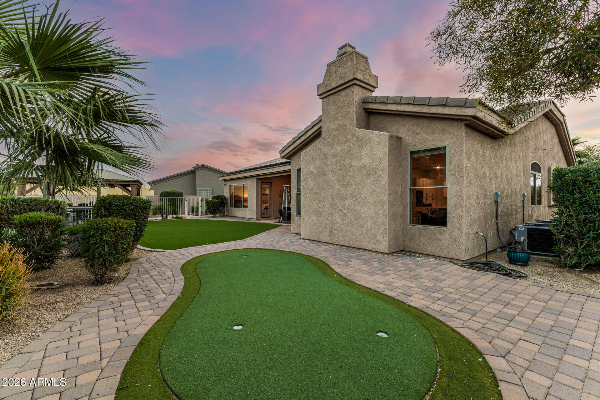 13318 West Coronado Road Goodyear, AZ 85395 - Photo 37 of 48 a front view of a house with a yard and garage