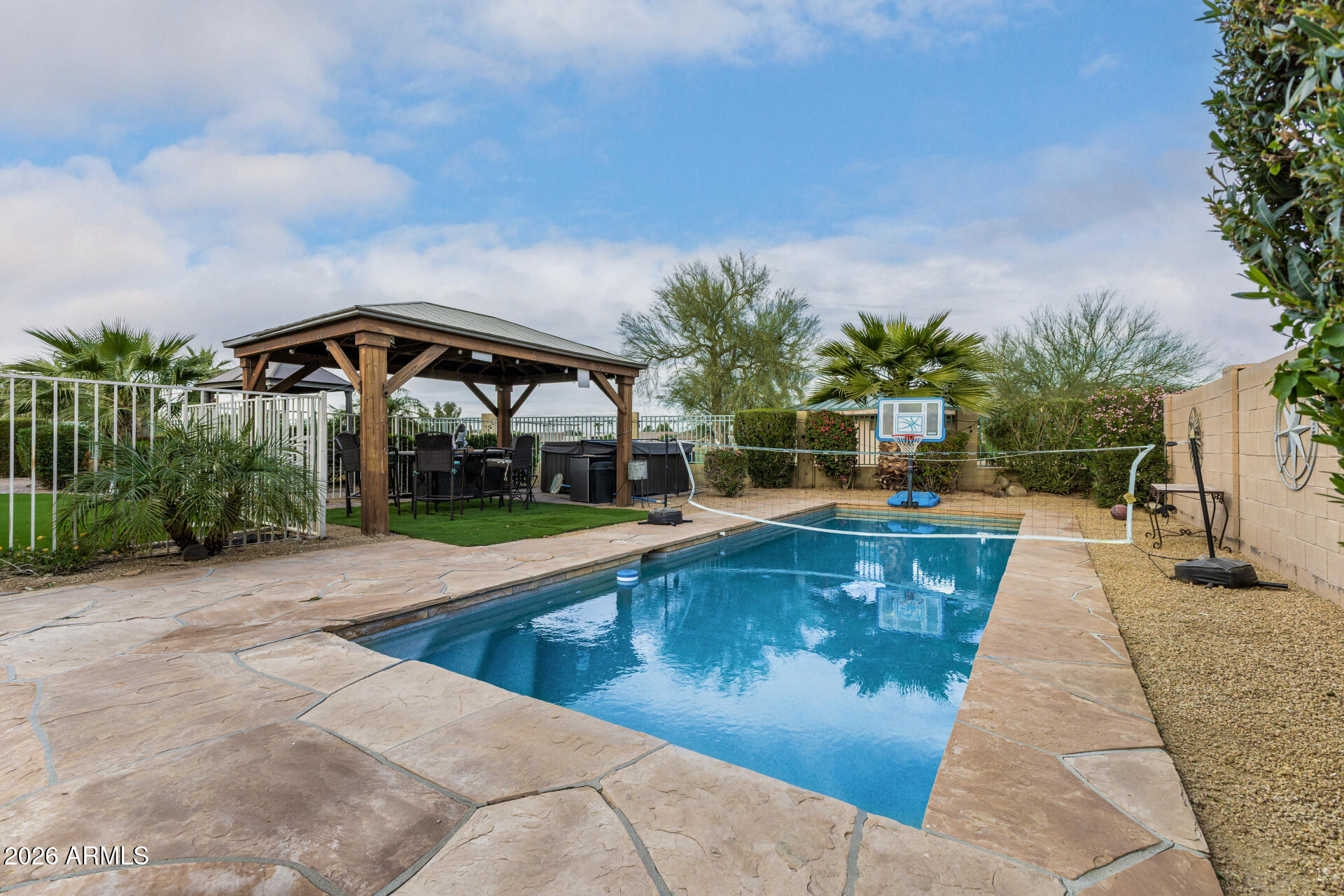 13318 West Coronado Road Goodyear, AZ 85395 - Photo 45 of 48 a view of swimming pool with outdoor seating and plants