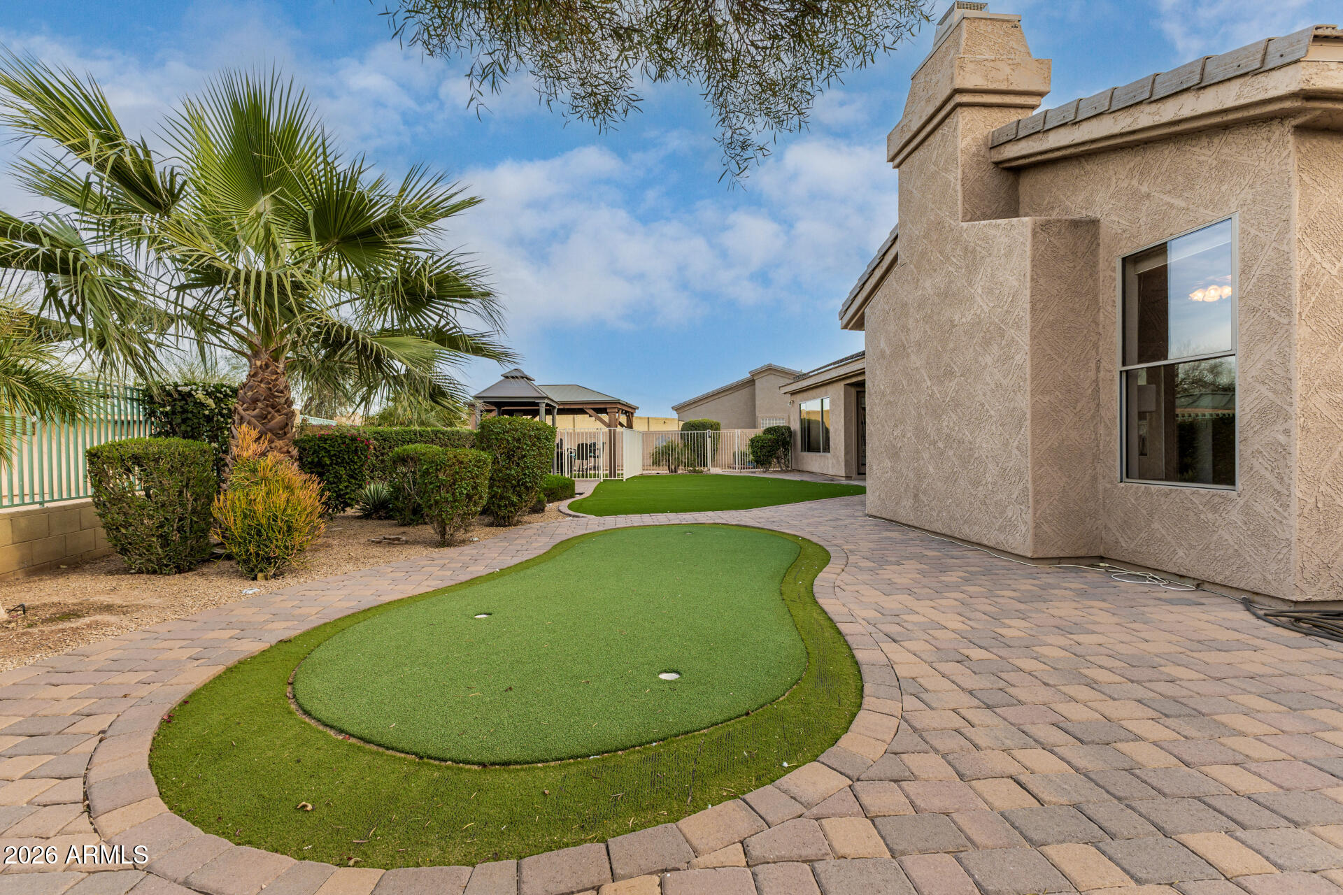 13318 West Coronado Road Goodyear, AZ 85395 - Photo 47 of 48 a view of a swimming pool with lounge chair