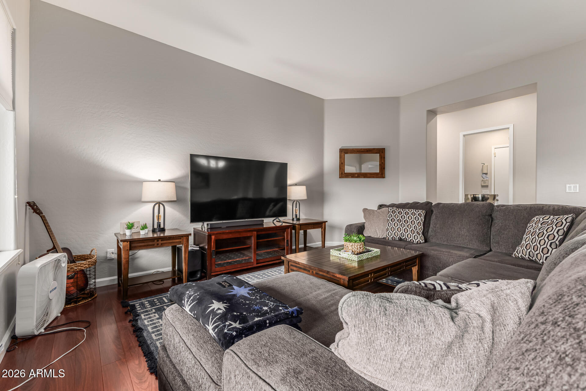 13318 West Coronado Road Goodyear, AZ 85395 - Photo 8 of 48 a living room with furniture and a flat screen tv