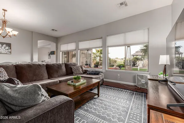 a living room with furniture and a large window