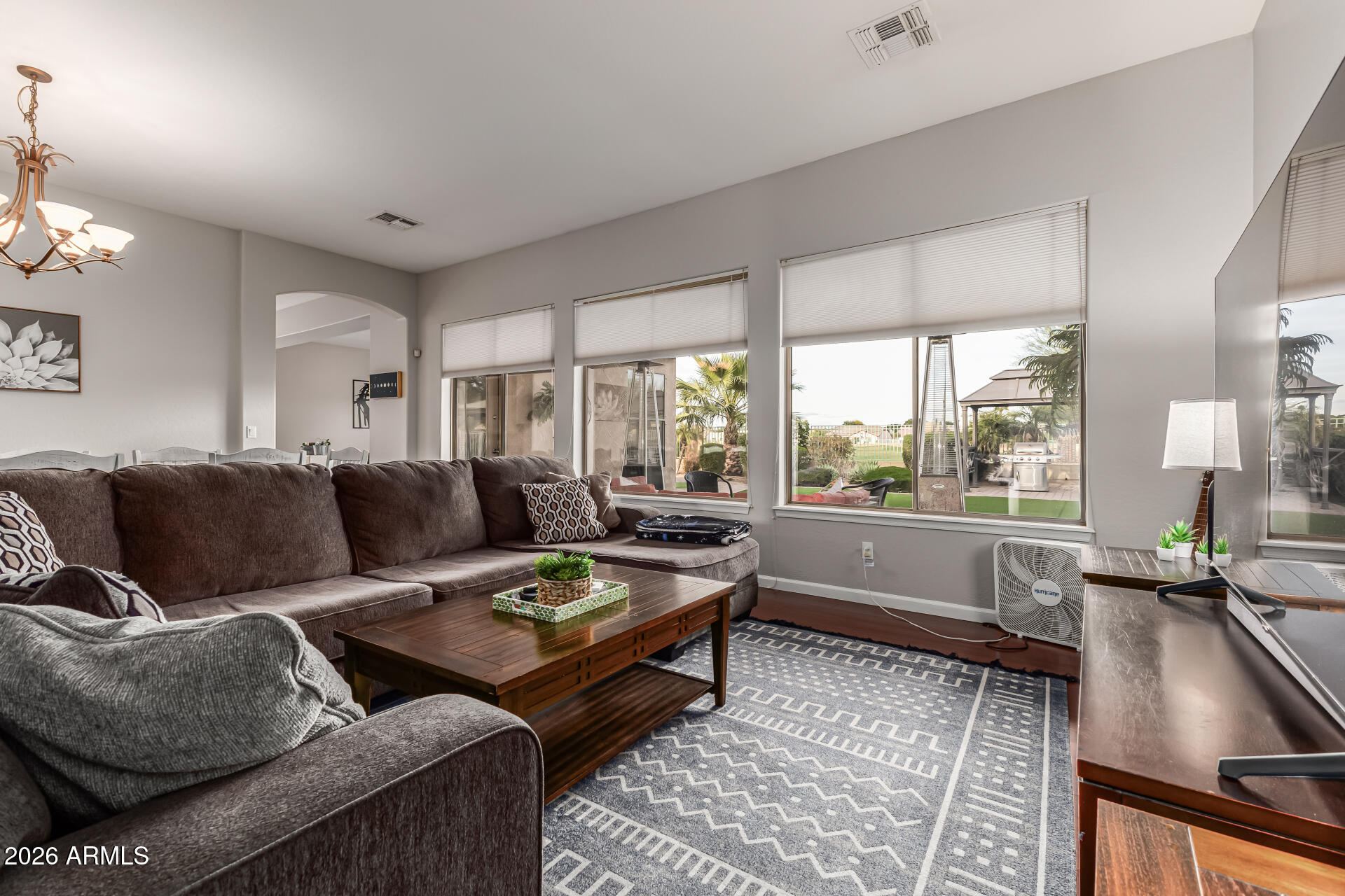13318 West Coronado Road Goodyear, AZ 85395 - Photo 9 of 48 a living room with furniture and a large window