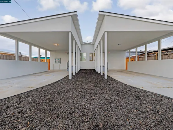 a view of a hallway with wooden floor and entryway