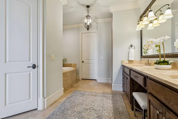 a bathroom with a granite countertop sink a toilet and a mirror