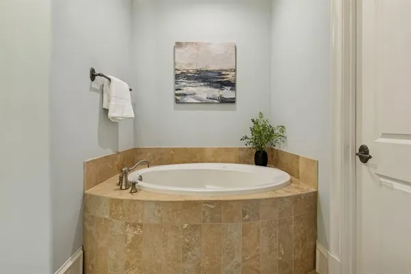 a bathroom with a tub and a shower