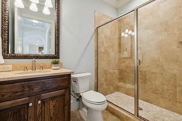 a bathroom with a sink toilet and shower