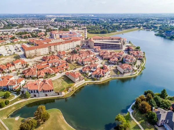 an aerial view of a house with a lake view