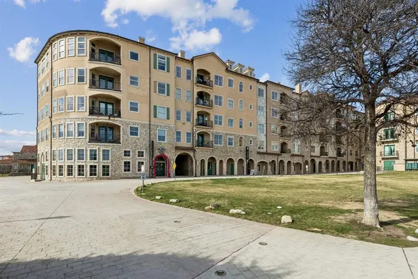 a front view of a building with garden