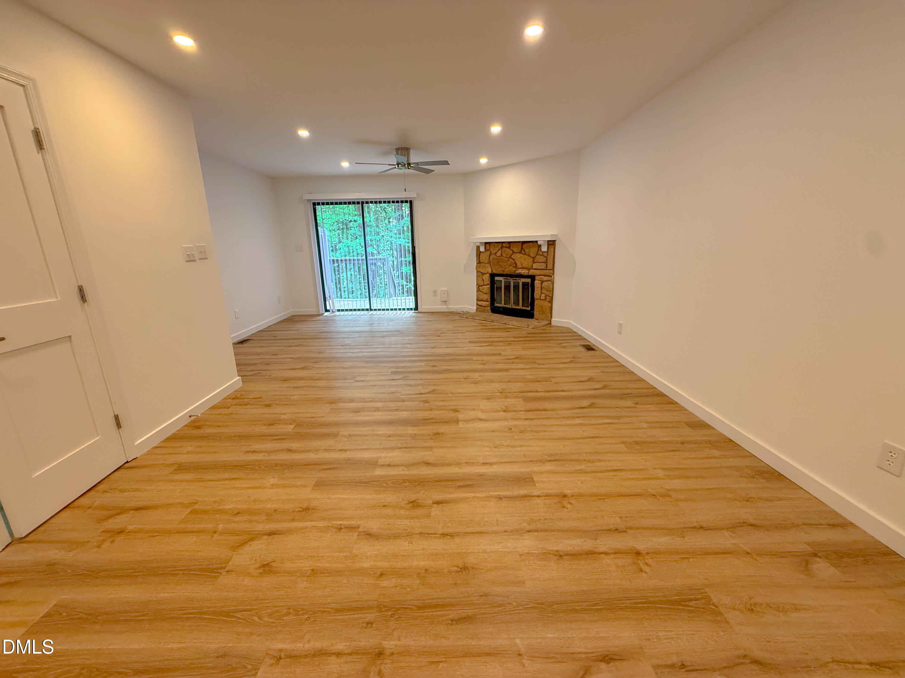 4247 The Oaks Drive Raleigh, NC 27606 - Photo 5 of 21 a view of empty room with wooden floor