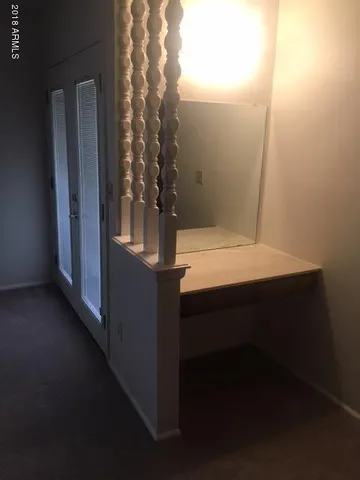 a white toilet sitting next to a bathroom sink