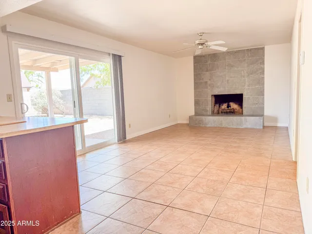 a kitchen with granite countertop a sink a stove a washer and dryer