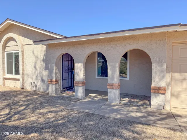 a view of a entryway with wooden floor