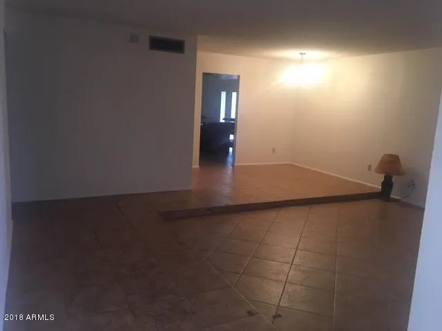 a kitchen with a stove a sink and a microwave