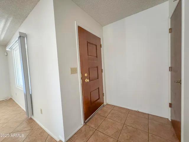 a view of a room that has a window in it