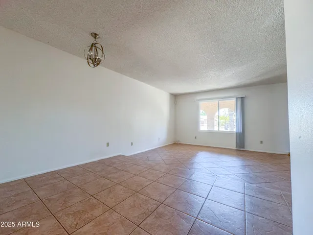 a view of hallway with chandelier