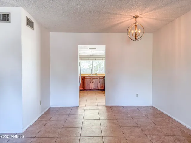 a view of a utility room with cabinet