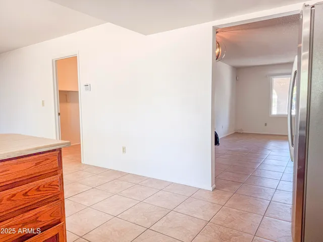a kitchen with a refrigerator a stove a washer and dryer