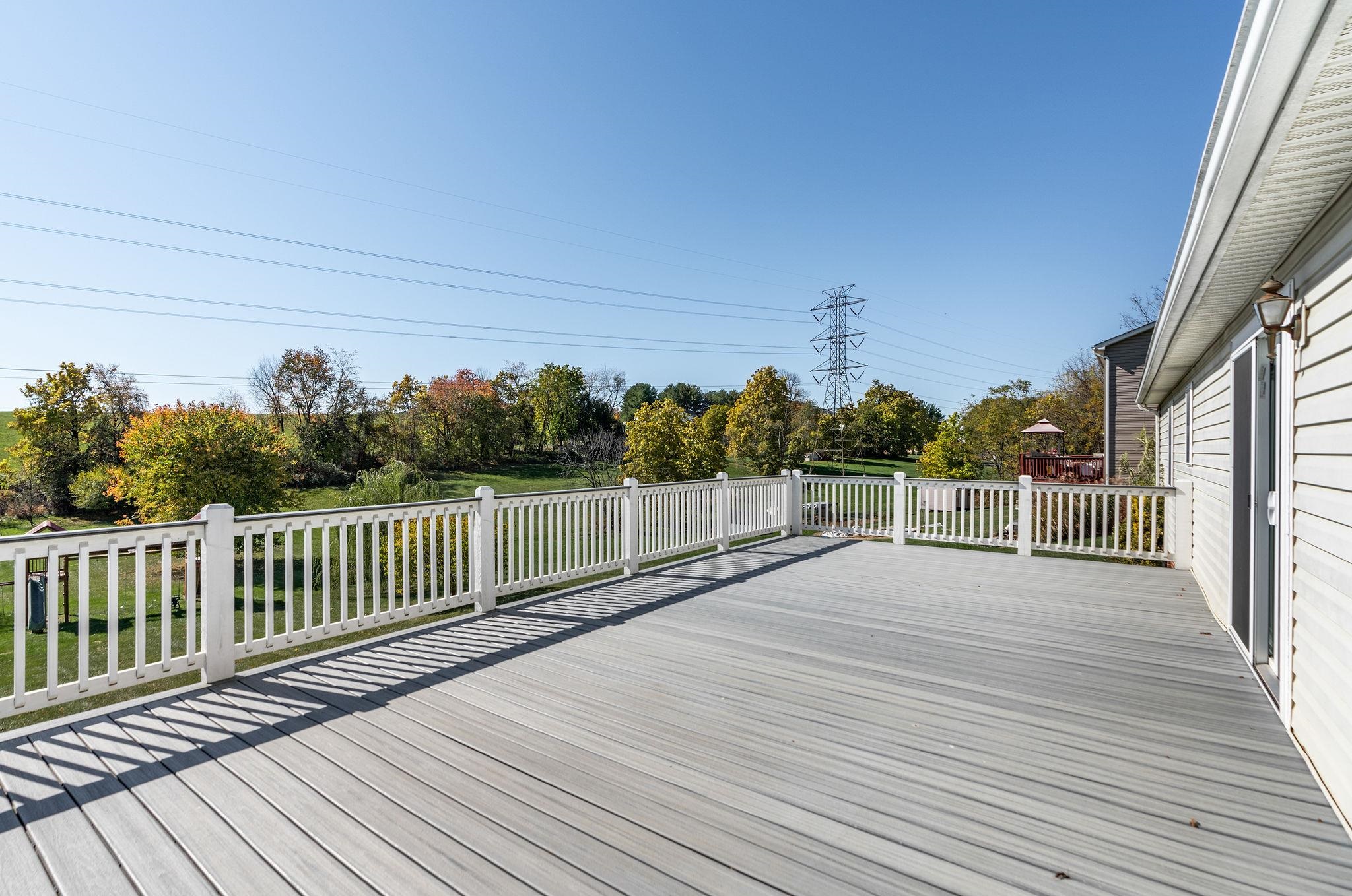 812 New Hope Road Staunton, VA 24401 - Photo 54 of 67 a view of a deck with wooden floor and fence with a large garden