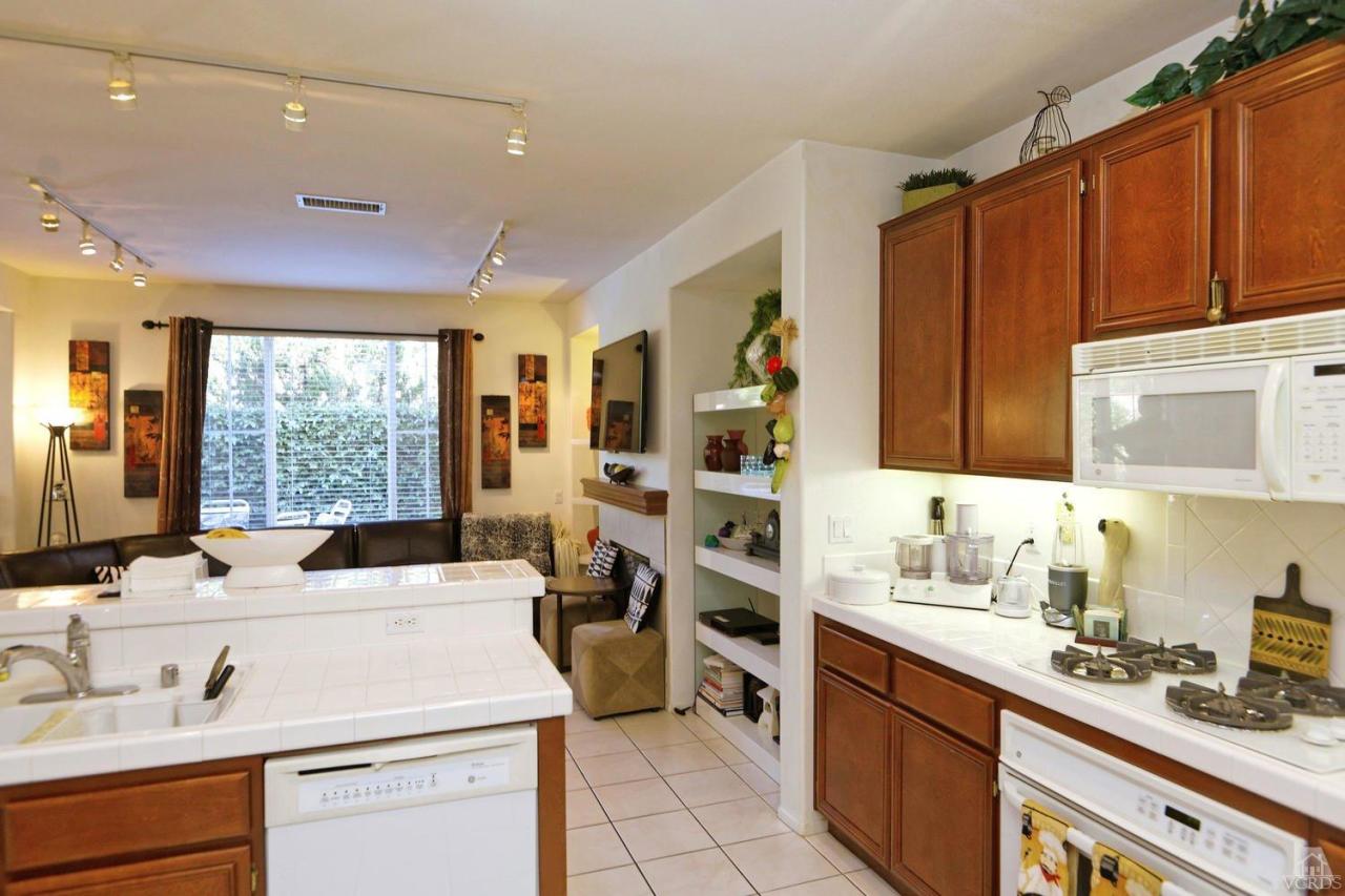 1854 Locust Street Simi Valley, CA 93063 - Photo 12 of 17 a kitchen that has a sink and a stove in it
