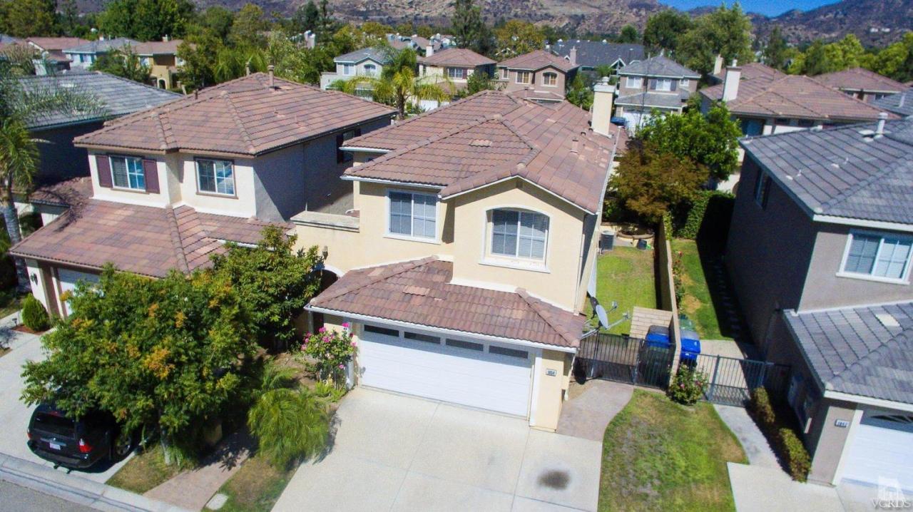 1854 Locust Street Simi Valley, CA 93063 - Photo 4 of 17 an aerial view of a house with swimming pool and glass windows