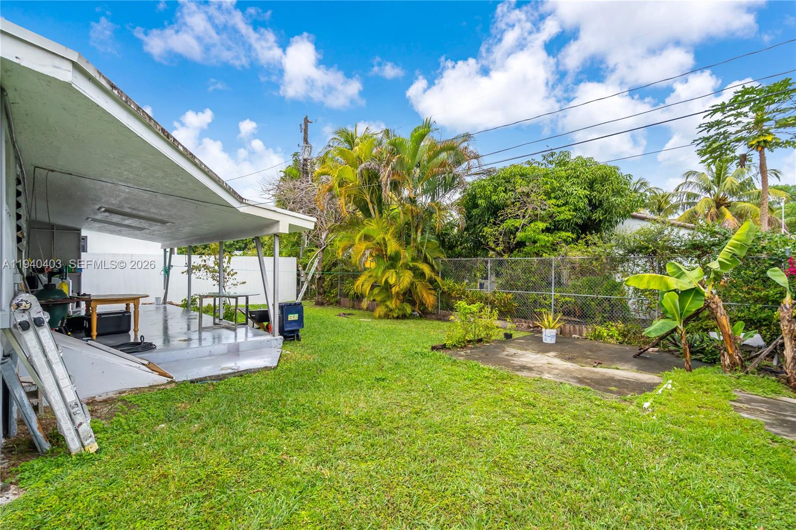 2145 Southwest 26th Street Miami, FL 33133 - Photo 21 of 26 a view of a patio with table and chairs and potted plants