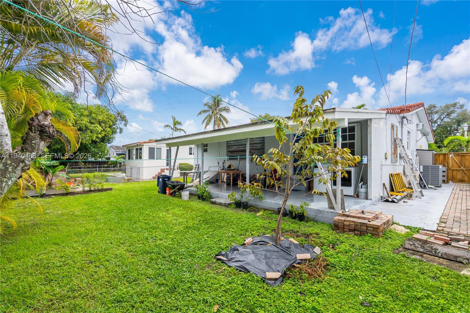 2145 Southwest 26th Street Miami, FL 33133 - Photo 22 of 26 a view of a house with backyard porch and sitting area