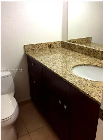a bathroom with a sink and vanity