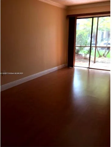 a view of a room with a large window