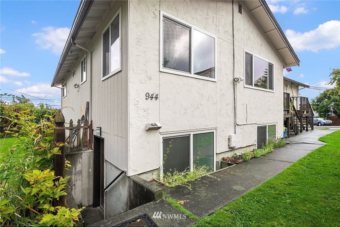 946 North 89th Street Seattle, WA 98103 - Photo 15 of 16 a front view of a house with a yard