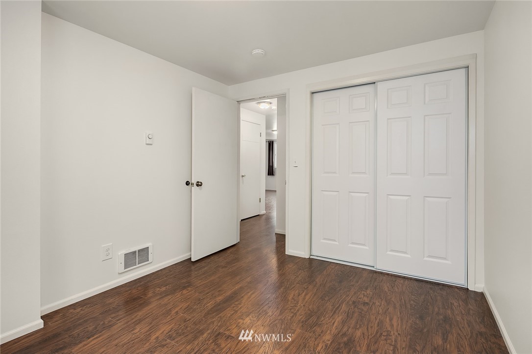 946 North 89th Street Seattle, WA 98103 - Photo 8 of 16 a view of an empty room and wooden floor