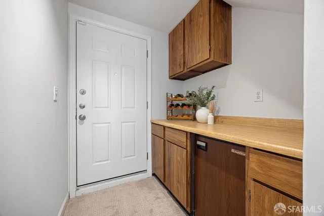 a kitchen with a sink a cabinets and window