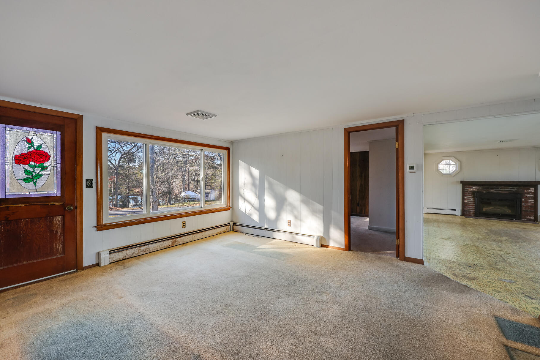 71 Buccaneer Way Mashpee, MA 02649 - Photo 11 of 32 a view of an empty room with a fireplace