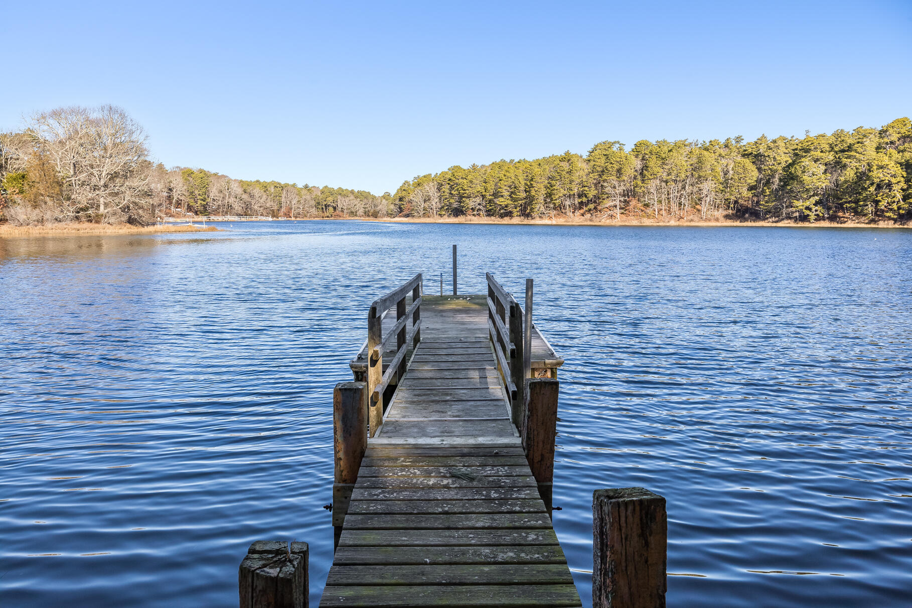 71 Buccaneer Way Mashpee, MA 02649 - Photo 17 of 32 a view of lake with mountain in the background