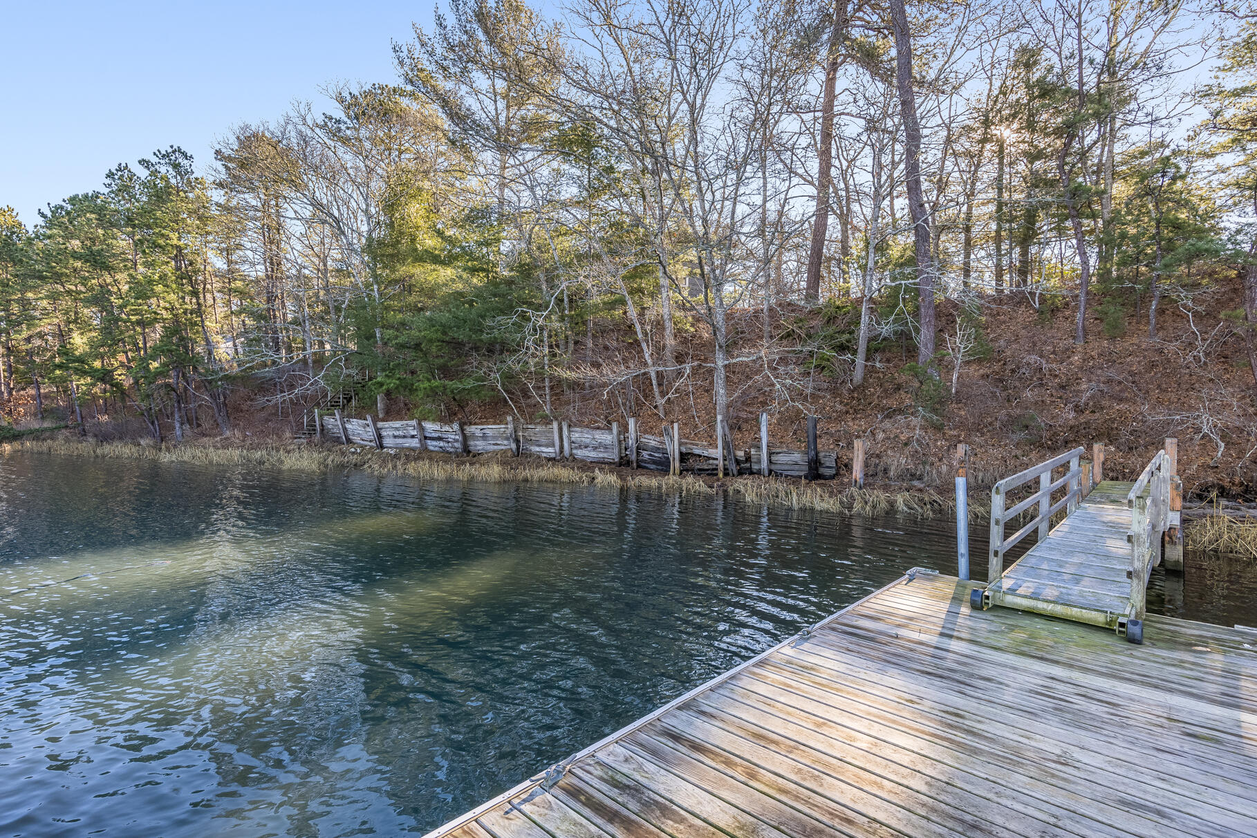 71 Buccaneer Way Mashpee, MA 02649 - Photo 18 of 32 a view of a lake with trees