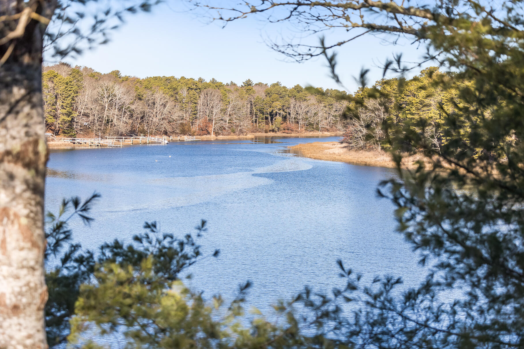 71 Buccaneer Way Mashpee, MA 02649 - Photo 9 of 32 a view of a lake with a mountain in the background