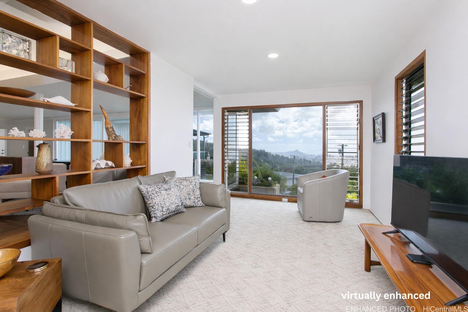 3233 Pacific Heights Road Honolulu, HI 96813 - Photo 7 of 25 a living room with furniture and a flat screen tv