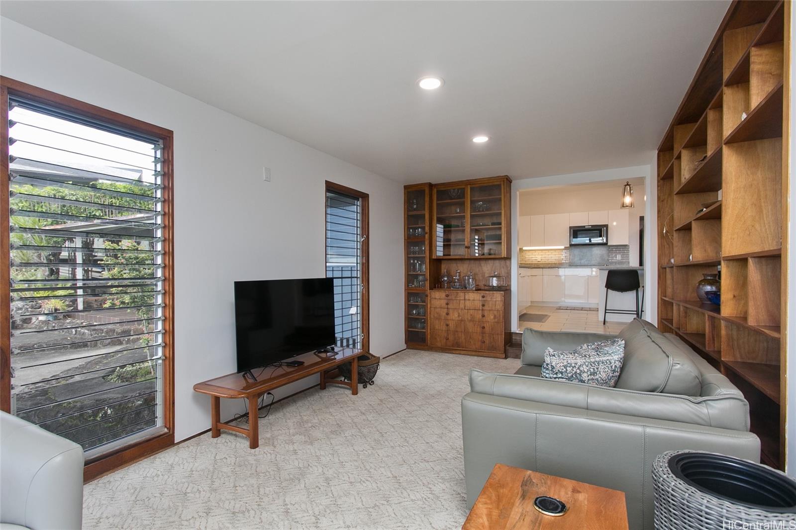 3233 Pacific Heights Road Honolulu, HI 96813 - Photo 8 of 25 a living room with furniture and a flat screen tv