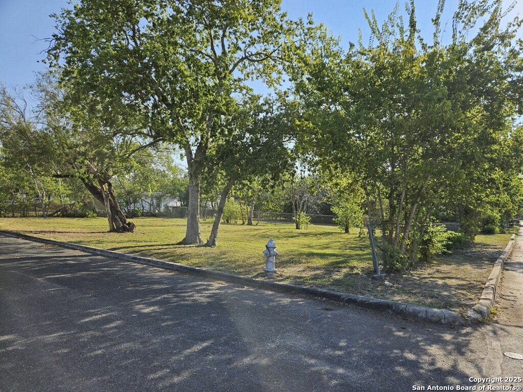 a view of a swimming pool with an outdoor space and seating area