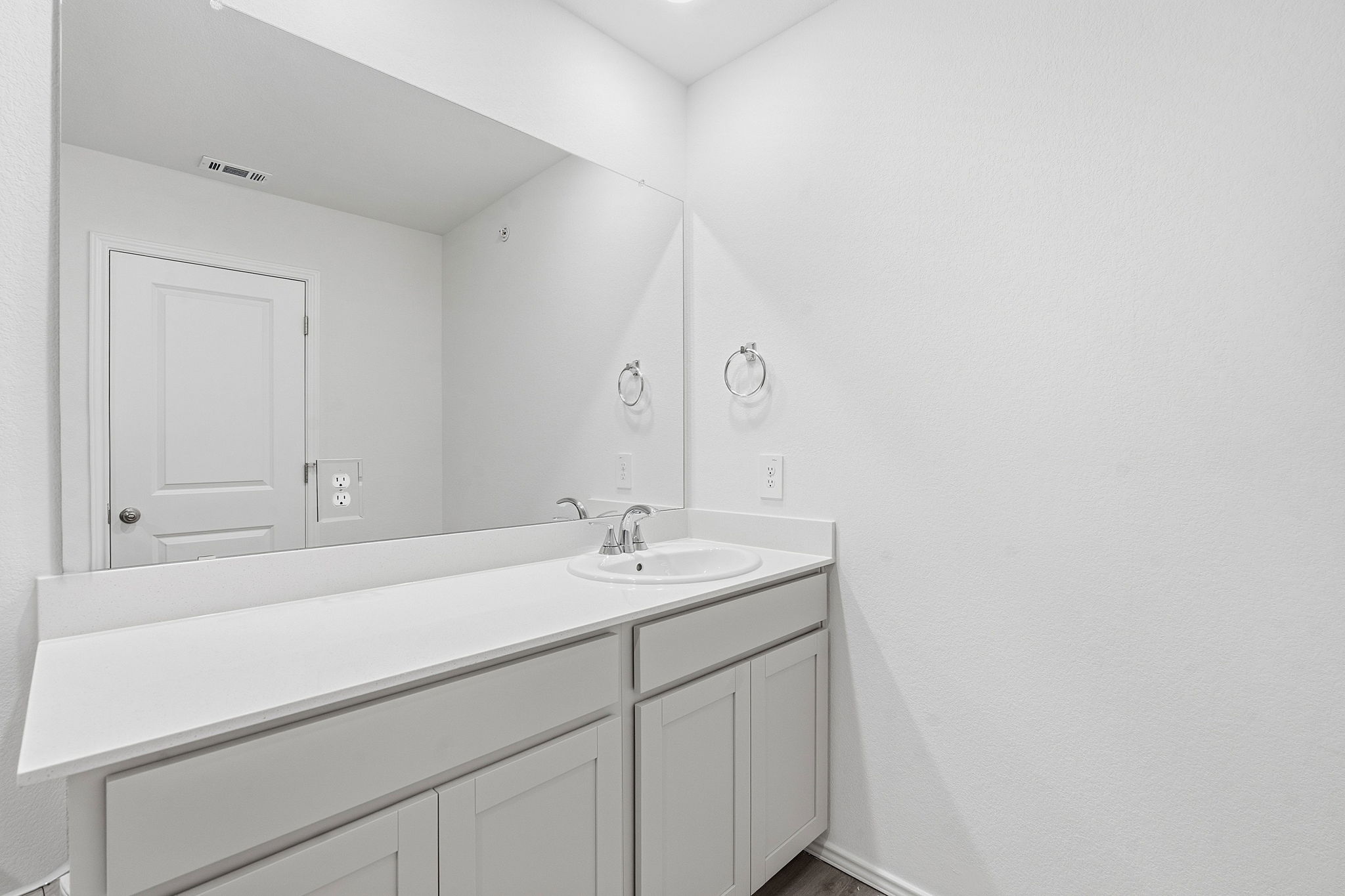 164 Cinnabar Lane, Unit 3 Kyle, TX 78640 - Photo 15 of 20 Bathroom vanity with a white countertop and integrated sink