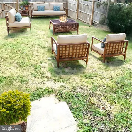 a view of a patio with couple of chairs
