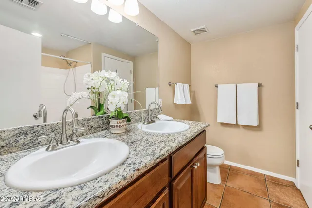 a bathroom with a white bath tub and a shower