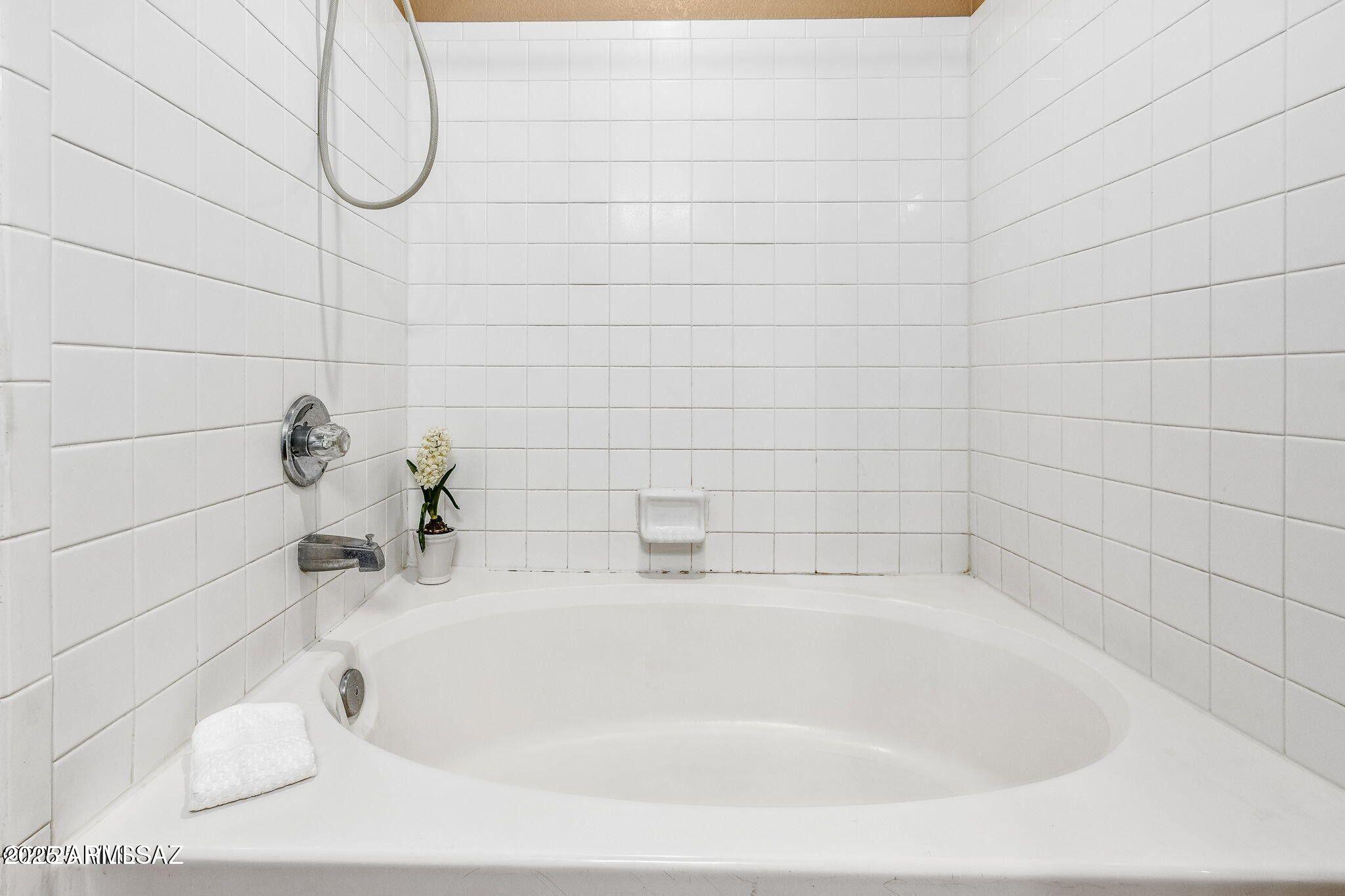11161 North Par Drive Oro Valley, AZ 85737 - Photo 18 of 35 a bathroom with a white bath tub and a shower
