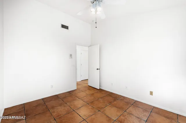 a kitchen with a sink and a refrigerator