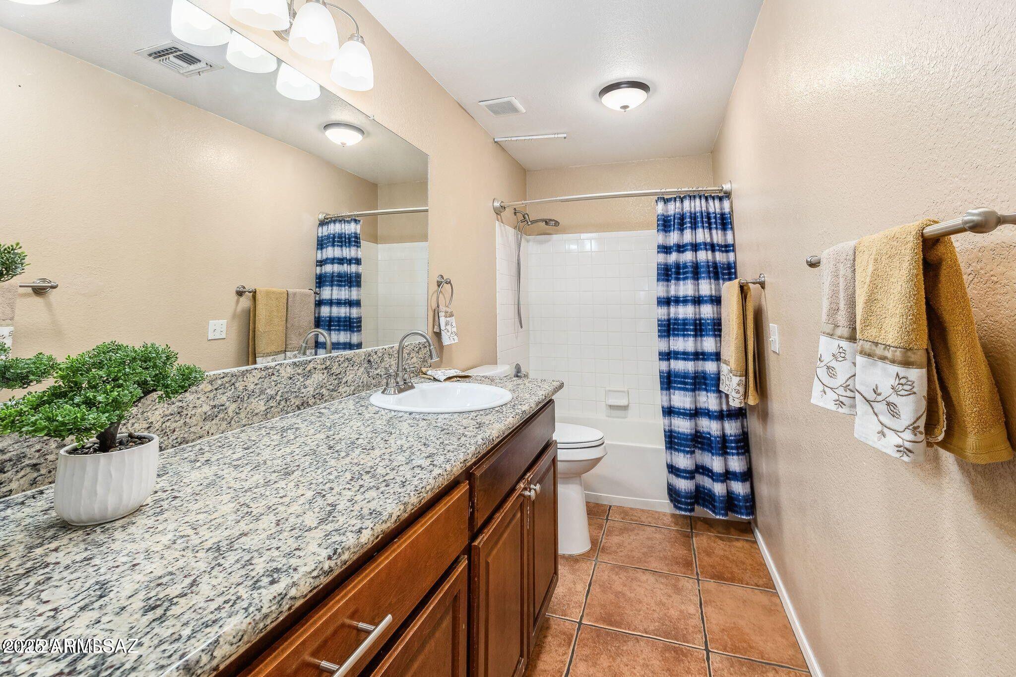 11161 North Par Drive Oro Valley, AZ 85737 - Photo 22 of 35 a kitchen with a sink and a refrigerator